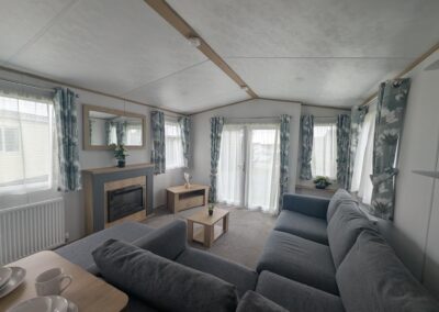 2021 Carnaby Silverdale lounge with L-shaped sofa and electric fireplace