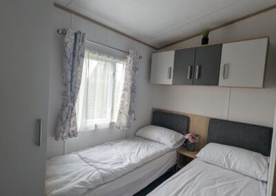 Carnaby Silverdale 2021 twin bedroom with wardrobe and overhead storage