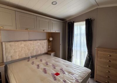 2026 Swift Vendee Lodge master bedroom with king-size bed and fitted storage